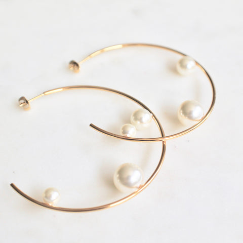 Floating pearl hoop earrings