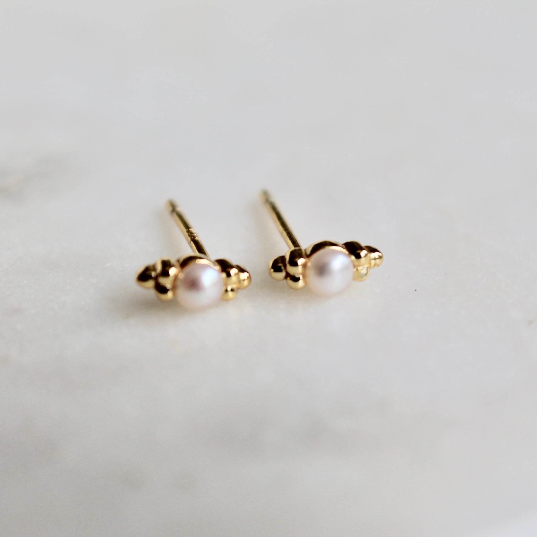 Tiny pearl studs