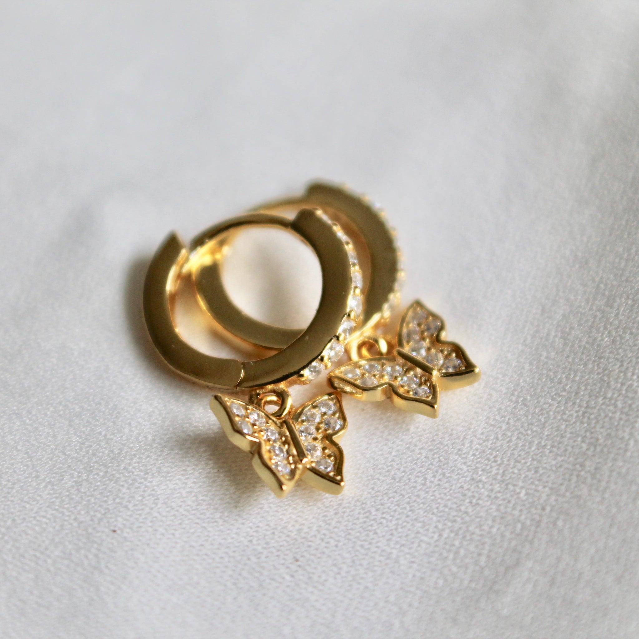 Mini butterfly huggie earrings