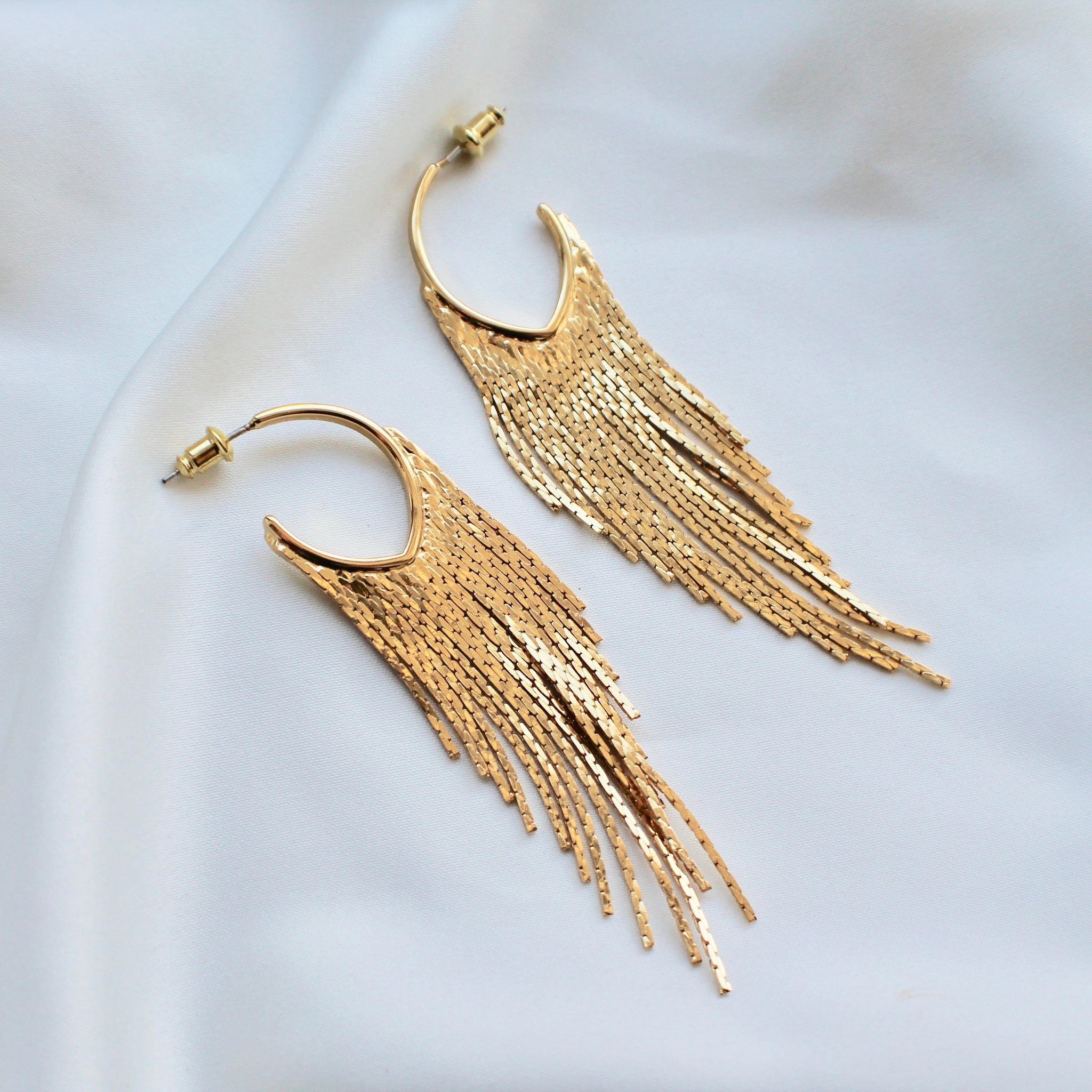 Gold fringe statement earrings